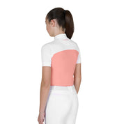 Back view of young model wearing the Girls' Slim Fit Competition Polo Shirt With Perforated Fabric in white and pink on a white background