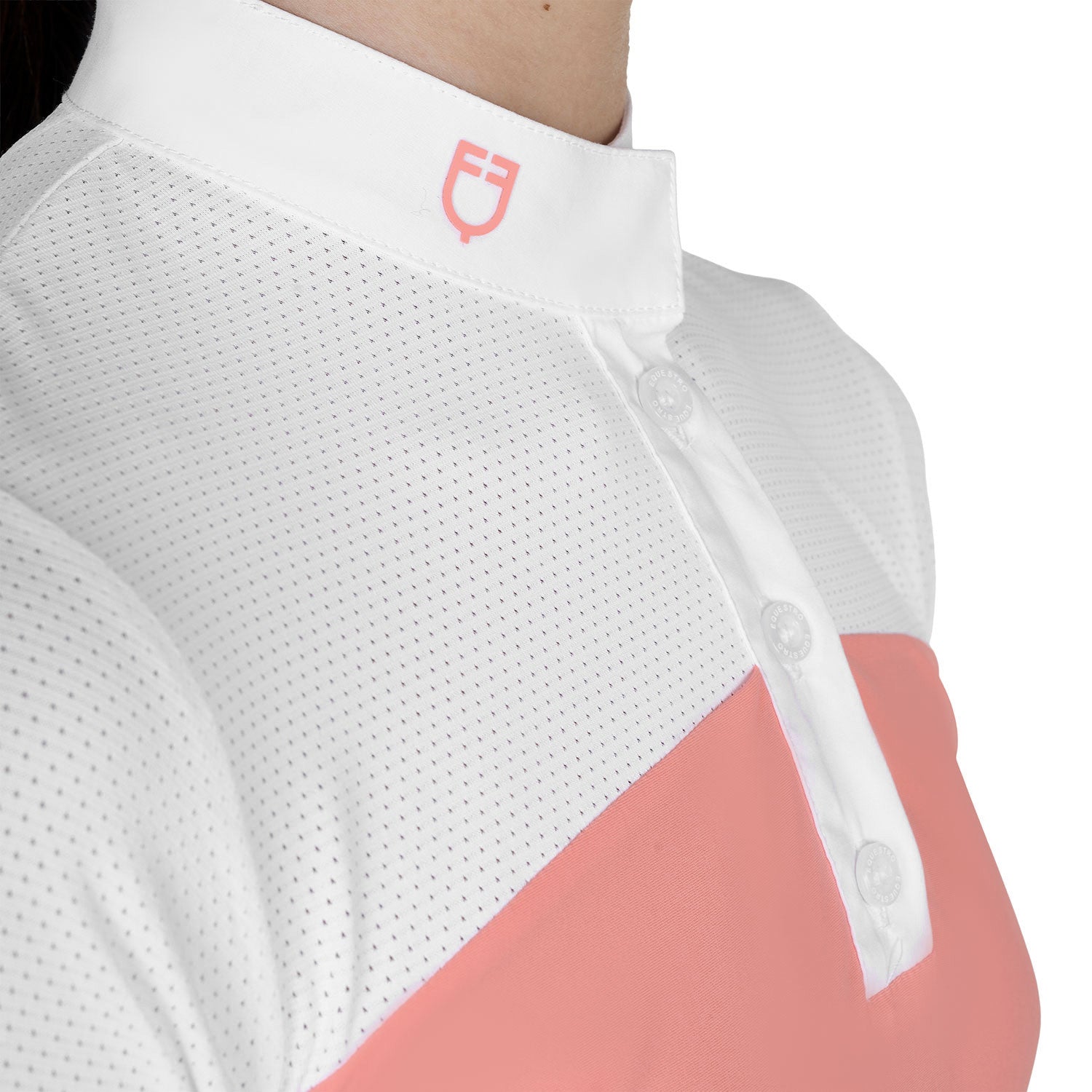 Close up front view  the white collar, pink logo, and white buttons on the Girls' Slim Fit Competition Polo Shirt With Perforated Fabric in white and pink