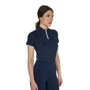 Front angled view of a model wearing the Equestro Women's Slim Fit Technical Training Polo Shirt in navy