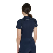 Back view of a model wearing the Equestro Women's Slim Fit Technical Training Polo Shirt in navy