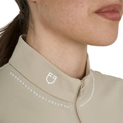 Close up front view of the tan collar and white logo the Equestro Women's Slim Fit Training Polo Shirt With Zip And Collar Beads