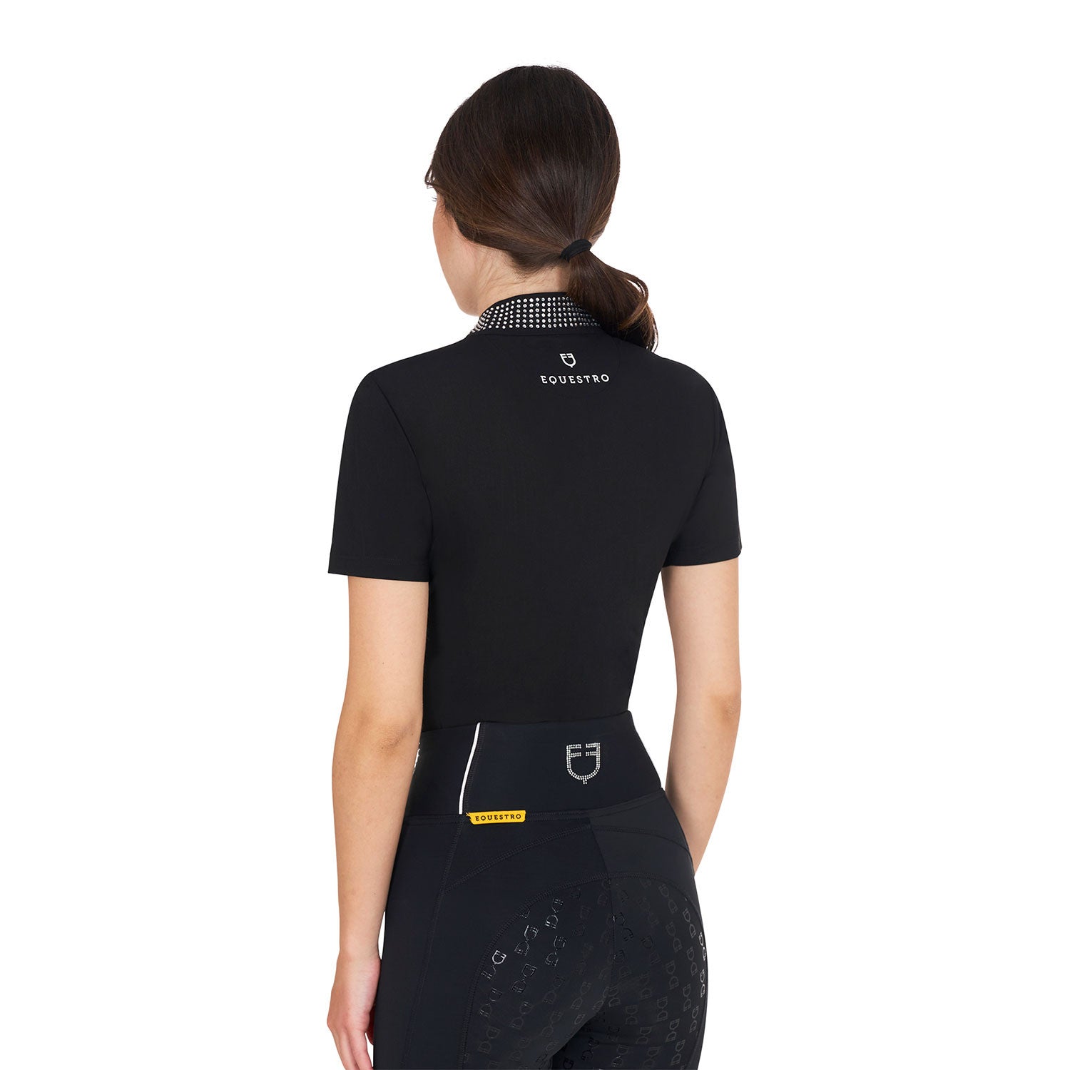 Back view of model wearing the Equestro Women's Slim Fit Training Polo Shirt With Zip And Collar Rhinestones in black on a white background