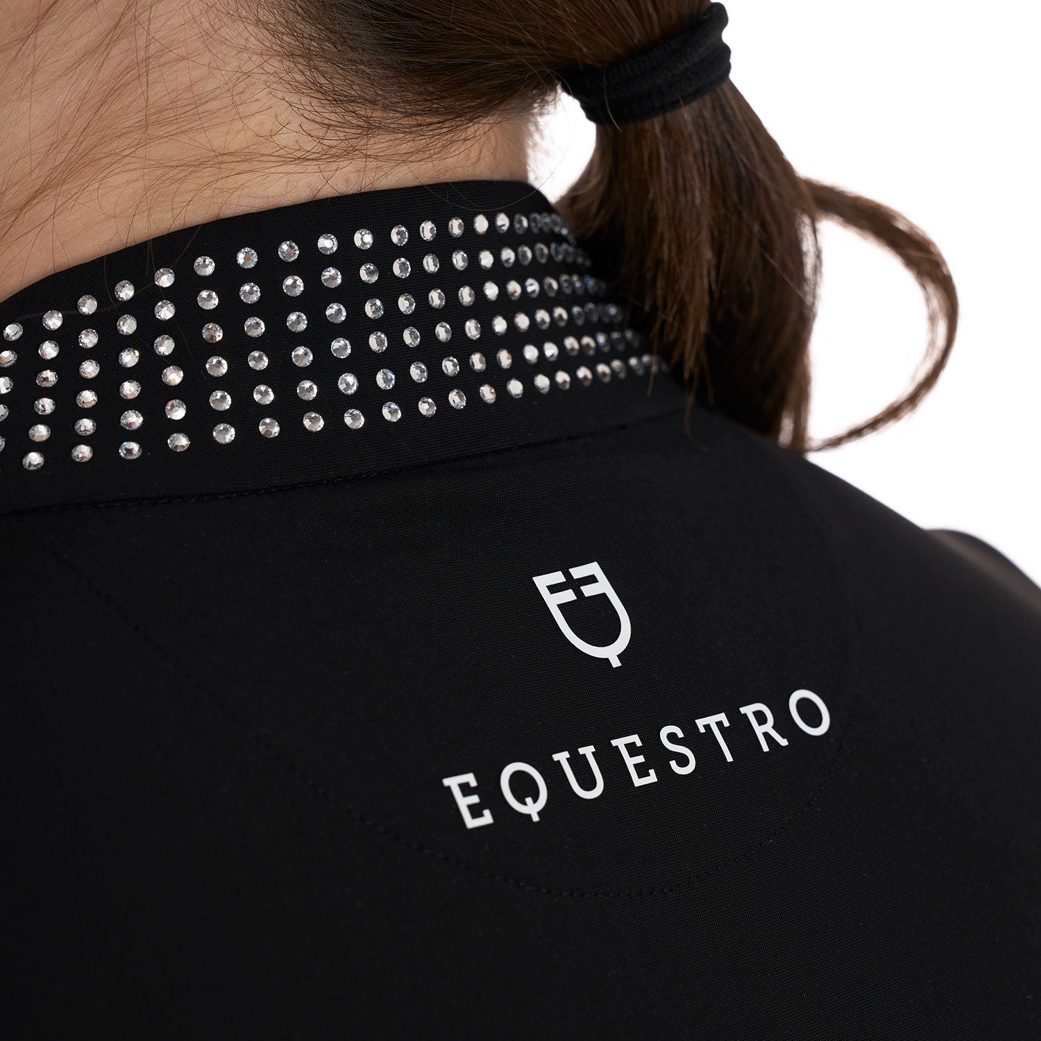 Back view of the rhinestone collar and Equestro logo of the Equestro Women's Slim Fit Training Polo Shirt With Zip And Collar Rhinestones in black 