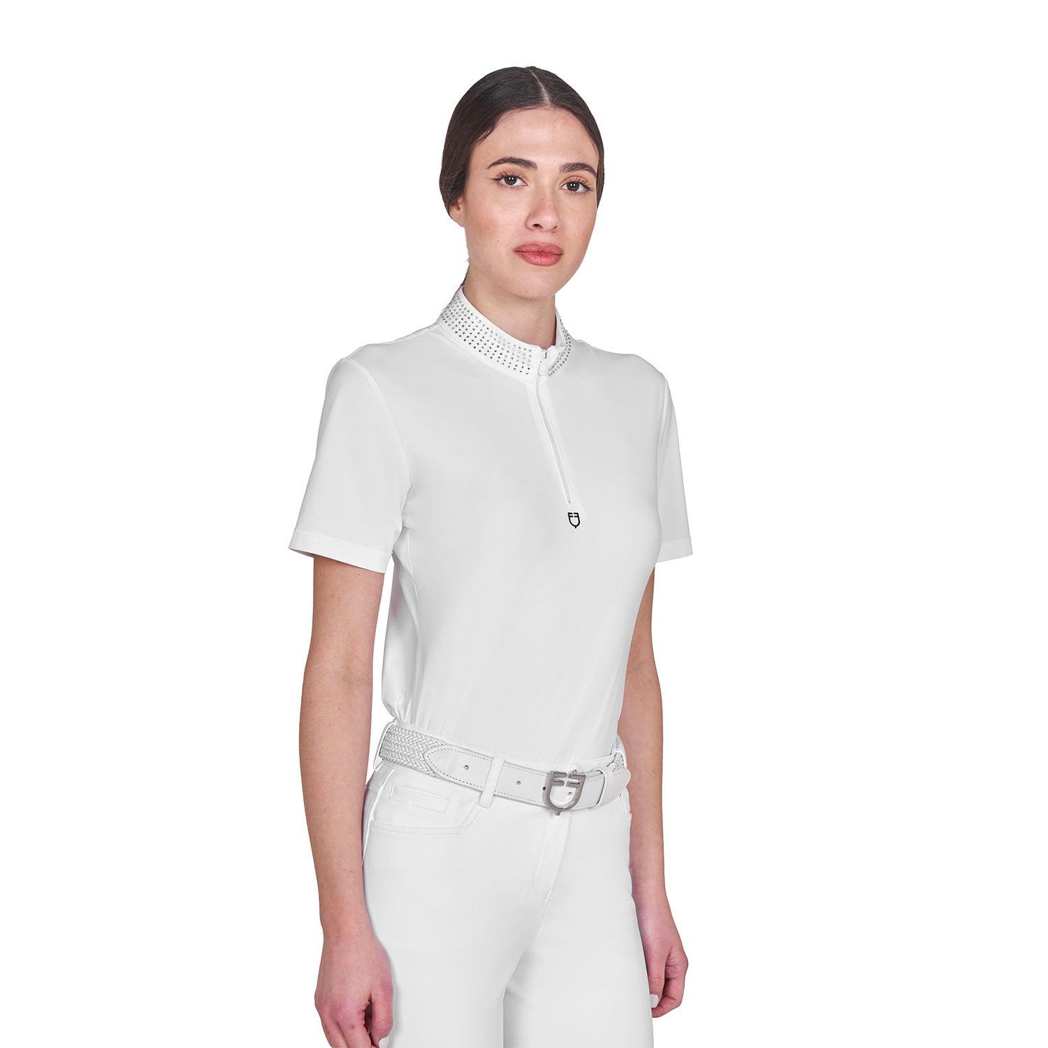Angled front view of model wearing the Equestro Women's Slim Fit Training Polo Shirt With Zip And Collar Rhinestones in white on a white background