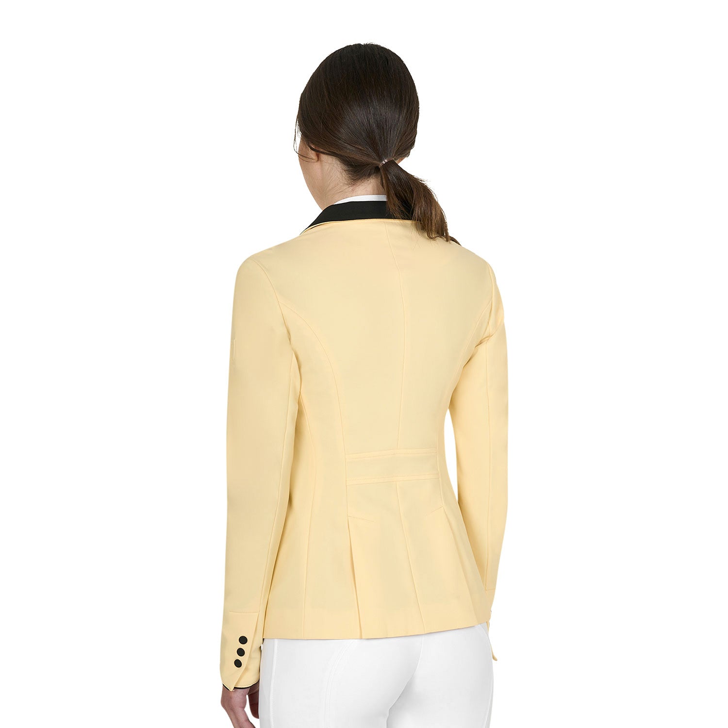 Back view of model wearing the Equestro Women's Competition Jacket With Zip And Buttons in yellow on a white background