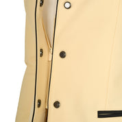 Close up front view of the concealed zip and buttons on the  Equestro Women's Competition Jacket With Zip And Buttons in yellow
