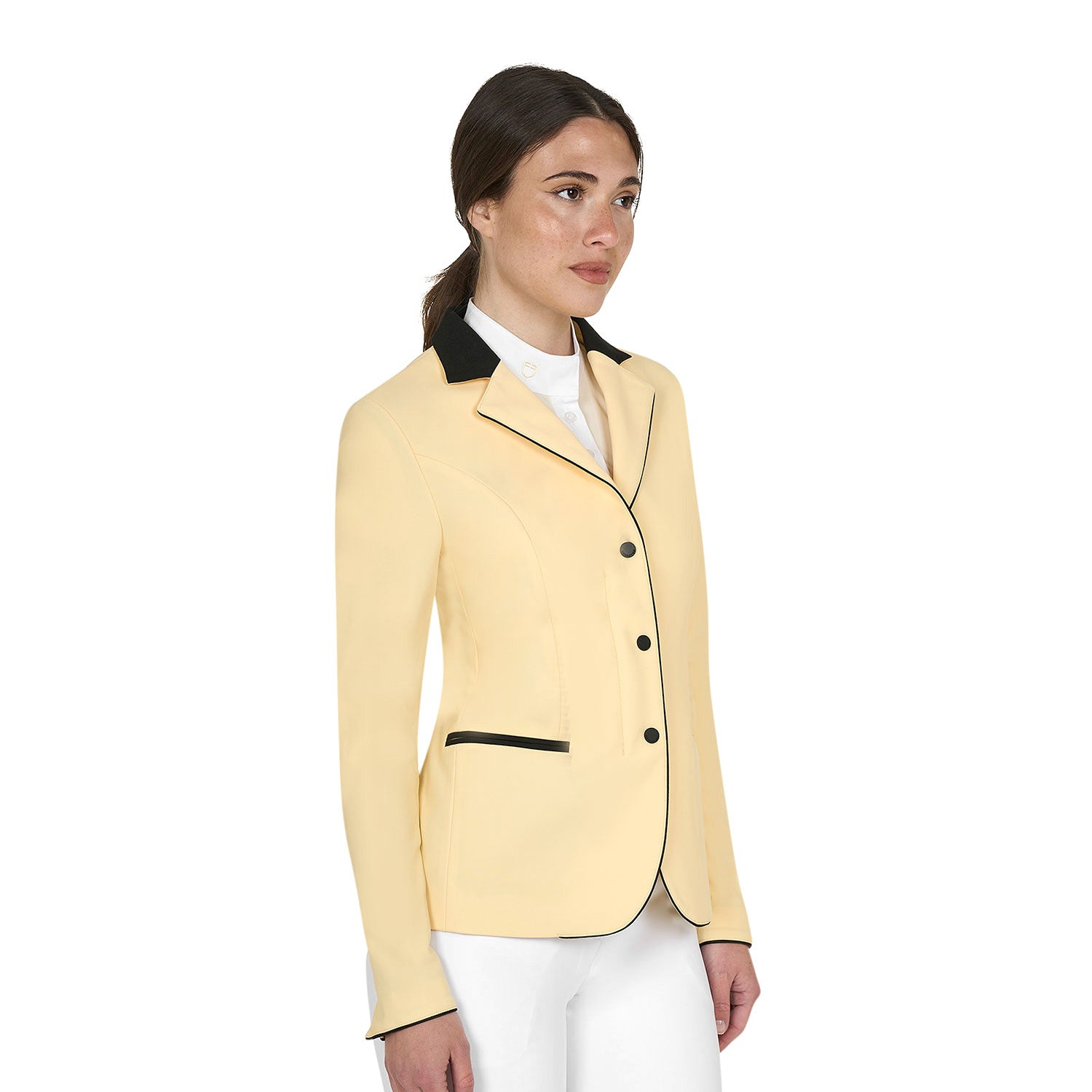 Angled front view of model wearing the Equestro Women's Competition Jacket With Zip And Buttons in yellow on a white background