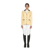 Full body front view of model wearing the Equestro Women's Competition Jacket With Zip And Buttons in yellow, white breeches, and black tall boots on a white background