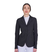 Front view of model wearing the Equestro Women's Competition Jacket With Zip And Buttons in black on a white background