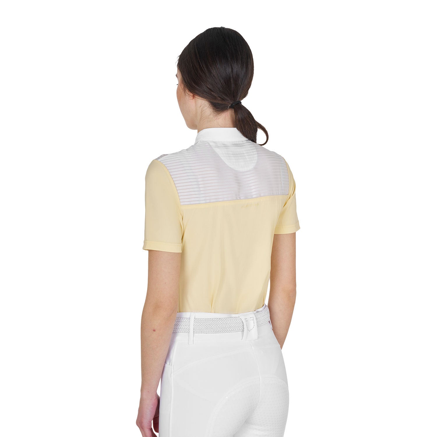 Back view of model wearing the Equestro Women's Slim Fit Competition Polo Shirt With Silk-Like Fabric Inserts in white and yellow on a white background