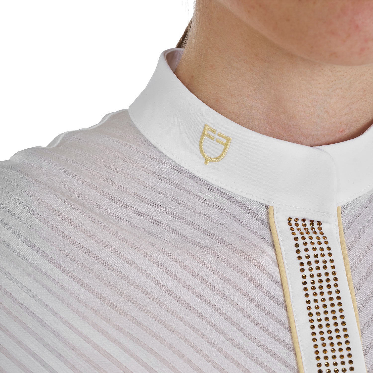 Close up front view of the white collar and gold logo of the Equestro Women's Slim Fit Competition Polo Shirt With Silk-Like Fabric Inserts