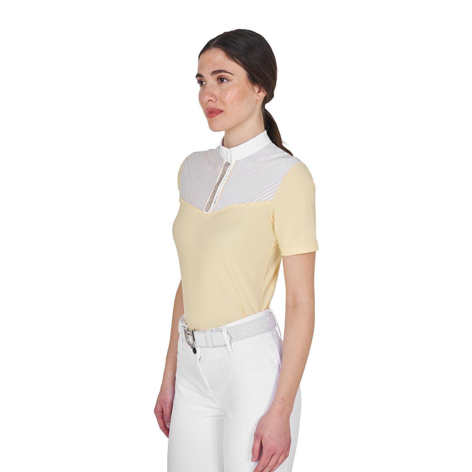 Angled front view of model wearing the Equestro Women's Slim Fit Competition Polo Shirt With Silk-Like Fabric Inserts in white and yellow on a white background