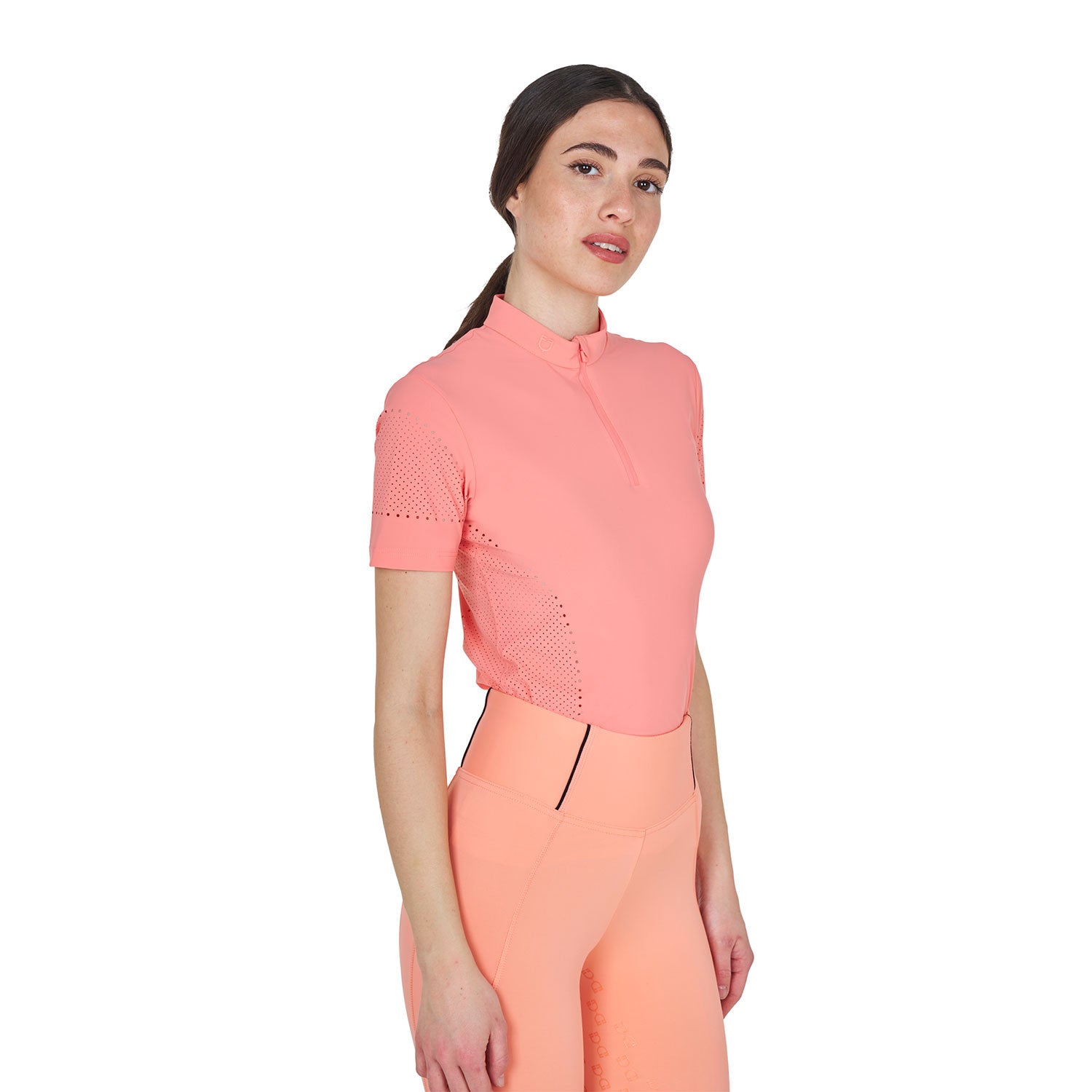 Angled front view of model wearing the Equestro Women's Training T-Shirt In Technical Fabric With Micro-Holes in pink on a white background
