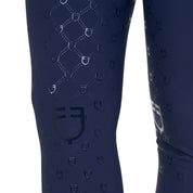 Close up view of the knee grip on the Equestro Women's High-Waisted Monogram Breeches in navy on a white background
