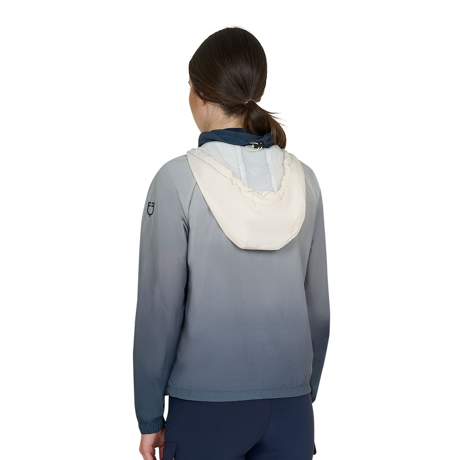 Back view of model wearing the Equestro Women's Water-Repellent Outerwear in ombre navy and white on a white background