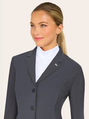 Charcoal gray equestrian show jacket with textured sleeves and side panels, notched lapel, and two-button front closure, shown layered over a white high-collar show shirt on a model against a plain light background.