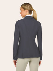 Back view of a charcoal gray equestrian show jacket with a tailored, fitted silhouette, textured fabric, contoured seams, and buttoned cuffs, shown over a white show shirt with light tan riding breeches on a model against a plain light background.