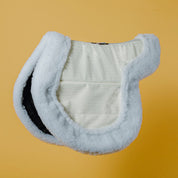 Side view of the pony Ecogold Secure Hunter Pad on a yellow background