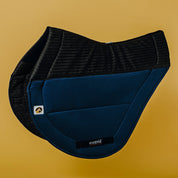 Side view of the navy Ecogold Secure Cross Country Pad on a yellow background