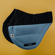 Side view of the slate blue Ecogold Secure Cross Country Pad on a yellow background