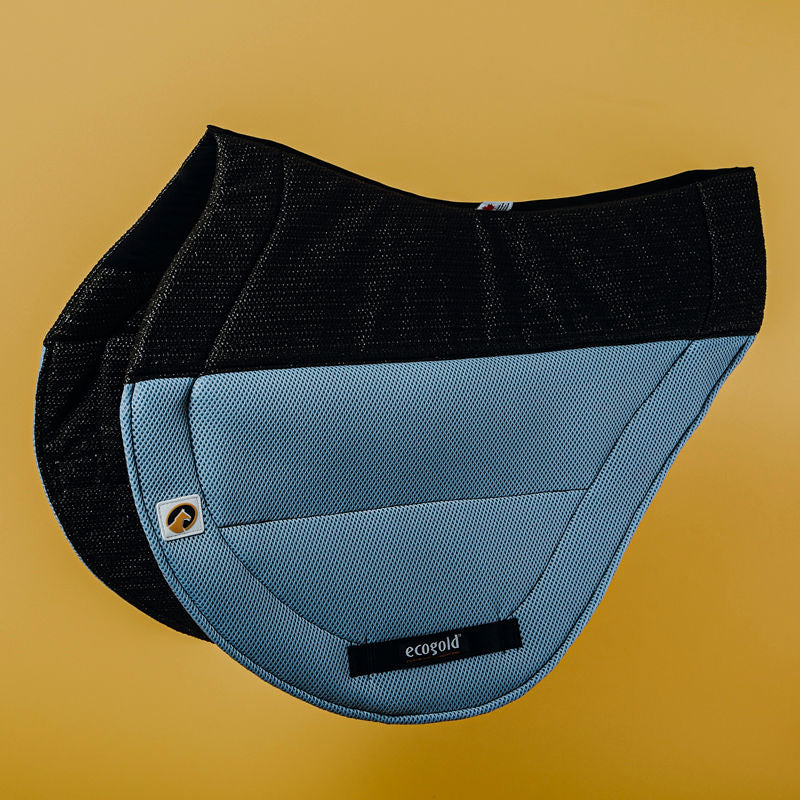 Side view of the slate blue Ecogold Secure Cross Country Pad on a yellow background