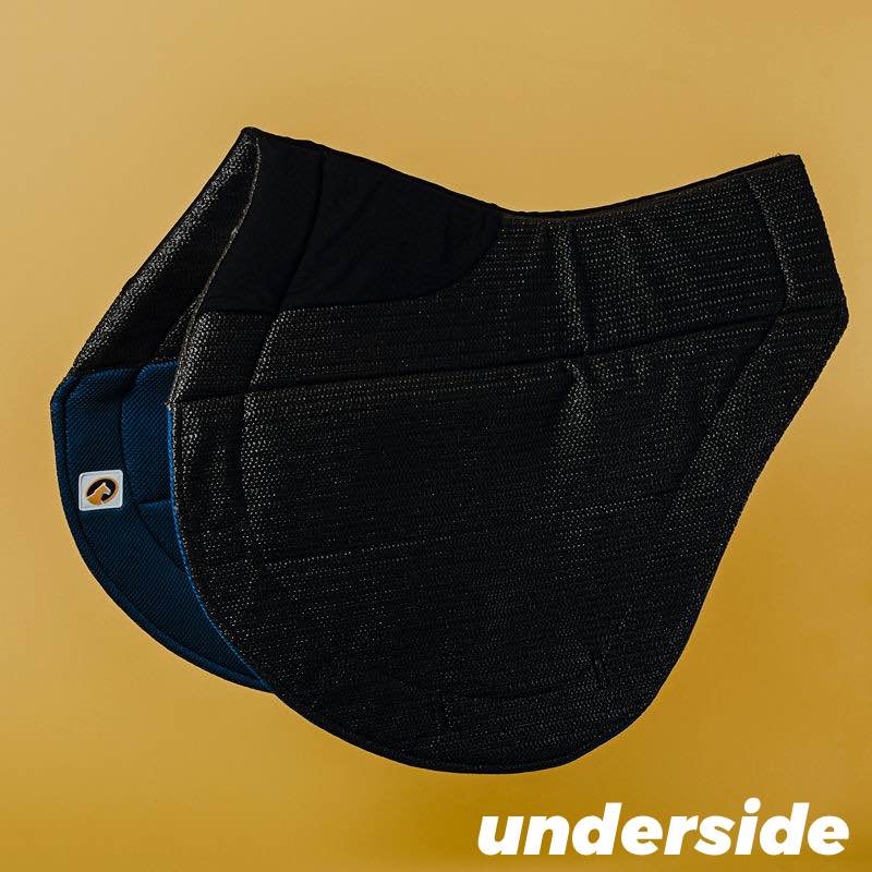 Side view of the underside of the navy black Ecogold Secure Cross Country Pad on a yellow background