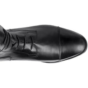 Close-up view of the toe cap on a black Ego 7 Orion Field Boot on a white background