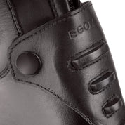Close-up view of the bottom zip guard on a black Ego 7 Orion Field Boot on a white background