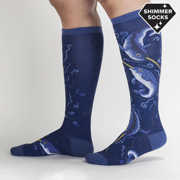 Side views of a person wearing the Once Upon a Narwhal Knee High Socks on a plain background