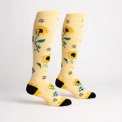 Side views of the Here Comes The Sun Sock It To Me Knee High Socks on a plain background