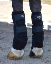Close-up back view of a horse wearing the Professional's Choice Ice Boots while standing in an arena