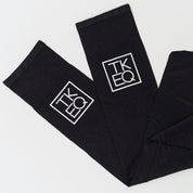 View of a pair of black TKEQ Logo Boot Socks on a white background