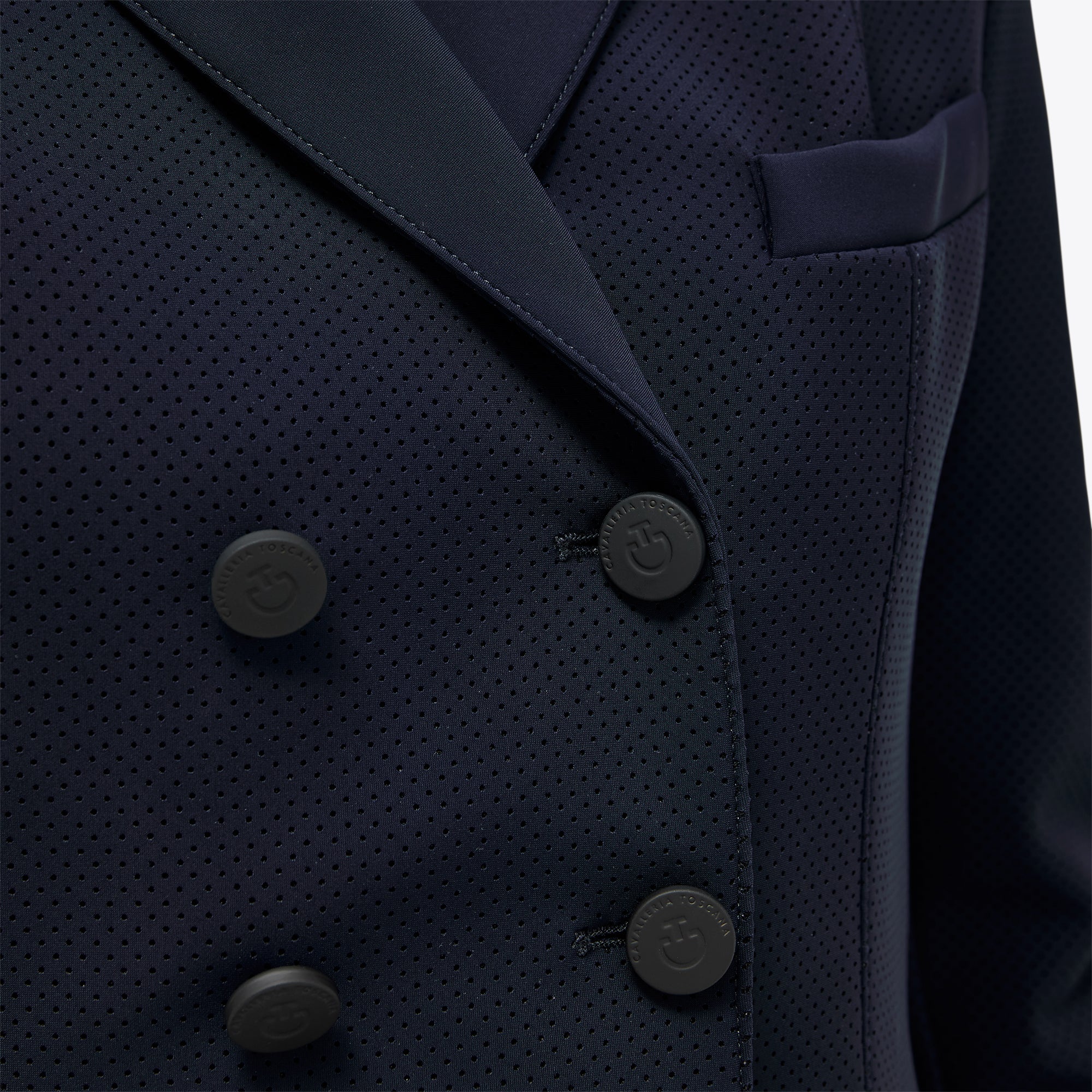 Close-up of Cavalleria Toscana navy competition frack showing double-breasted front with matte buttons
