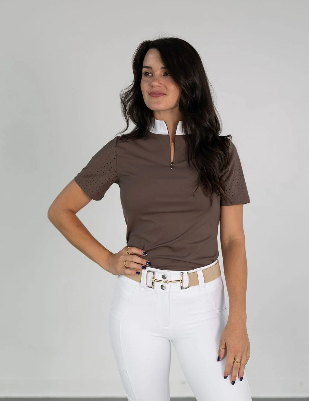 Front view of a female model wearing the brown Free Ride Cassidy Short Sleeve Show Shirt on a plain background