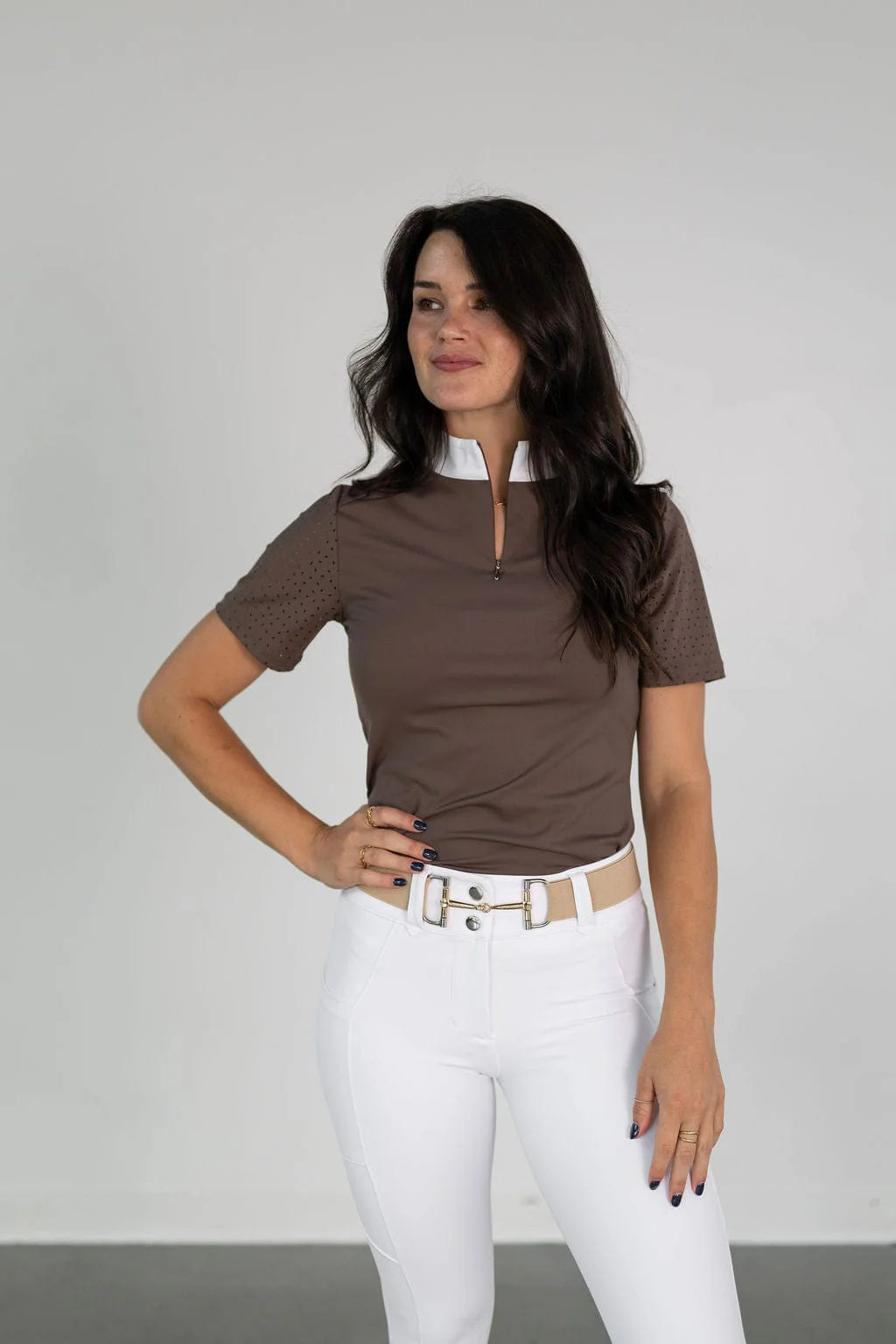 Front view of a female model wearing the brown Free Ride Cassidy Short Sleeve Show Shirt on a plain background