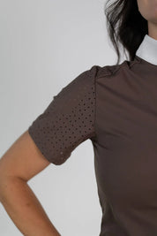 Close-up view of the laser cut perforations on the sleeve of the brown Free Ride Cassidy Short Sleeve Show Shirt