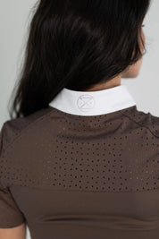 Close-up back view of the laser cut perforations on the back of the brown Free Ride Cassidy Short Sleeve Show Shirt
