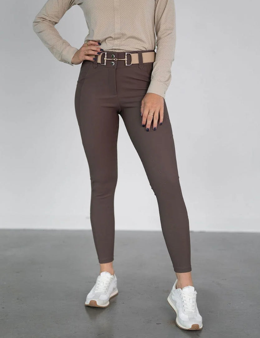 Front view of a model wearing the brown Free Ride PRO Full Seat Breeches on a plain background
