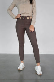Front view of a model wearing the brown Free Ride PRO Full Seat Breeches on a plain background