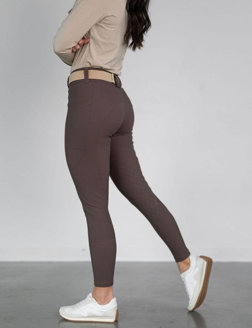 Side view of a model wearing the urban bronze Free Ride PRO Knee Patch Breeches on a plain background