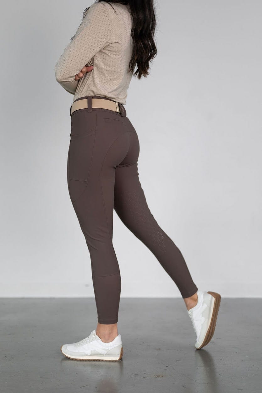 Side view of a model wearing the urban bronze Free Ride PRO Knee Patch Breeches on a plain background
