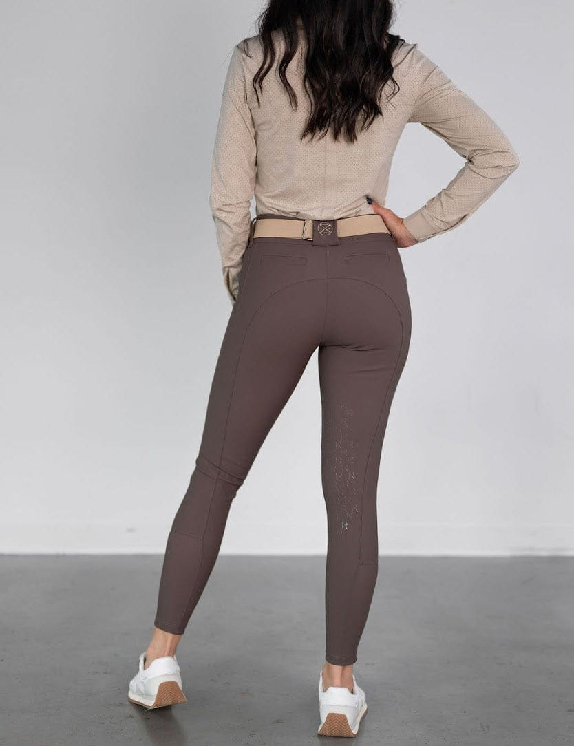 Rear view of a model wearing the urban bronze Free Ride PRO Knee Patch Breeches on a plain background