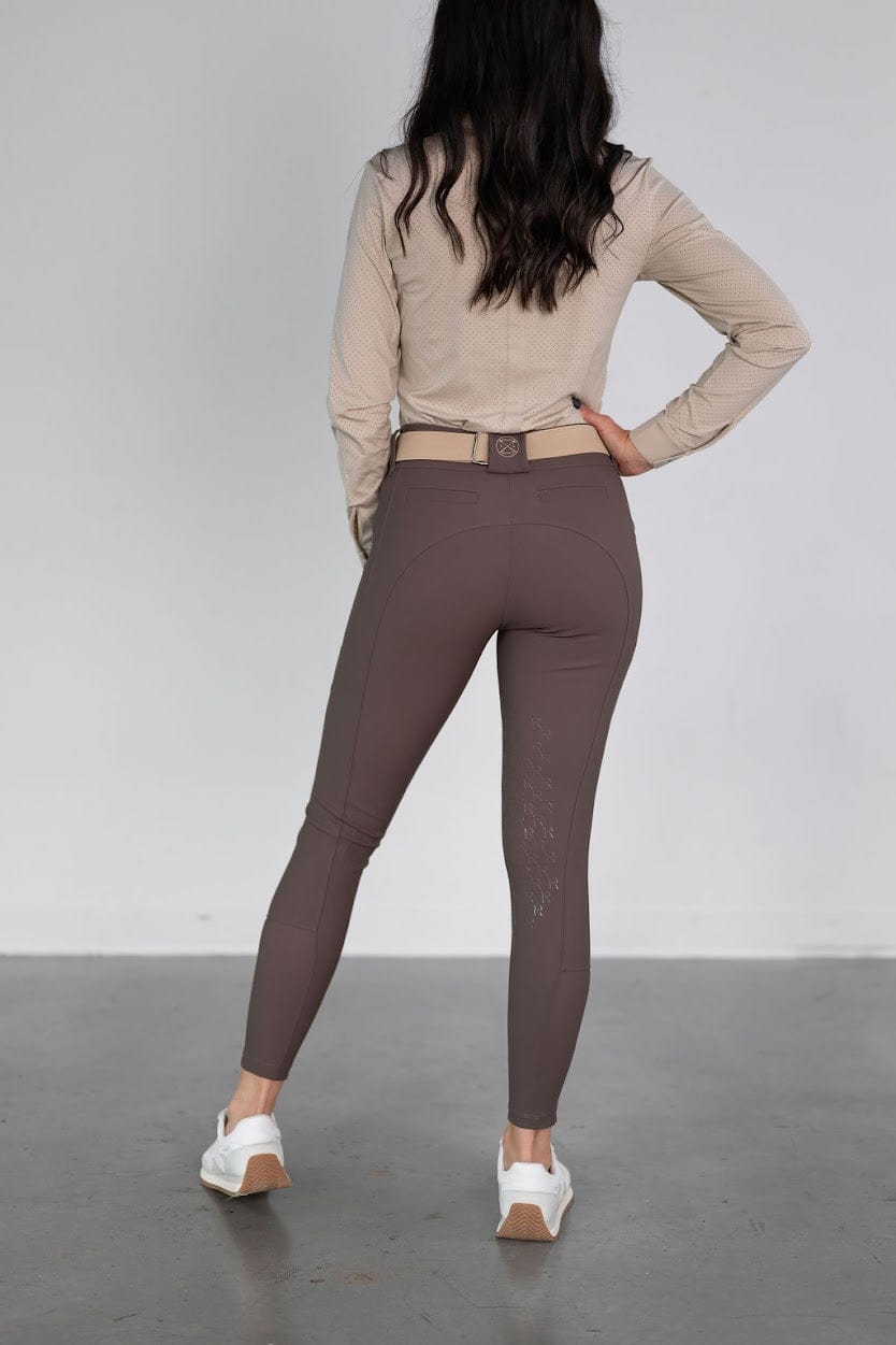 Rear view of a model wearing the urban bronze Free Ride PRO Knee Patch Breeches on a plain background