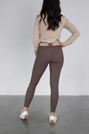 Rear view of a model wearing the urban bronze Free Ride PRO Knee Patch Breeches on a plain background