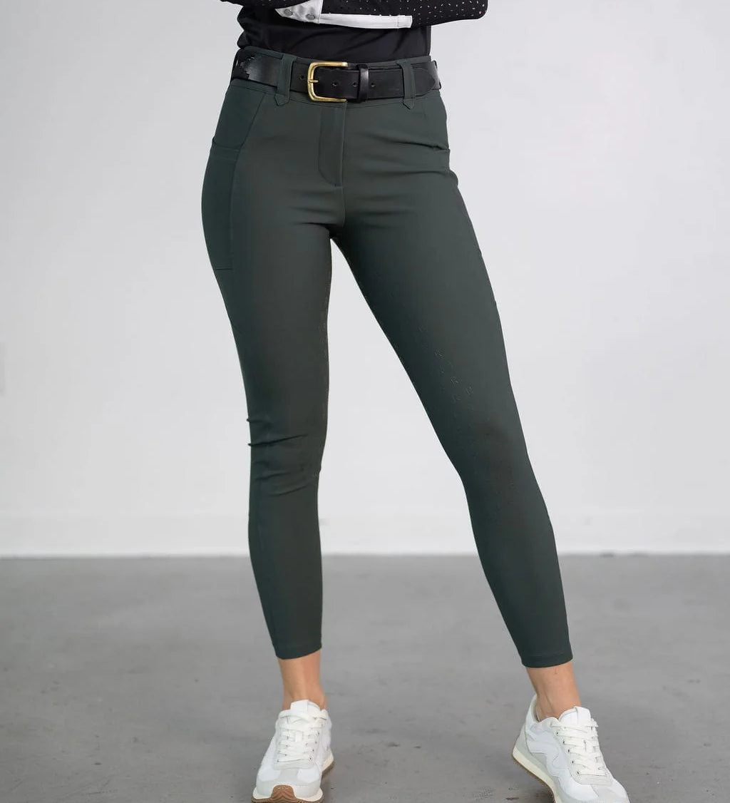 Front view of a model wearing the green Free Ride PRO Full Seat Breeches on a plain background