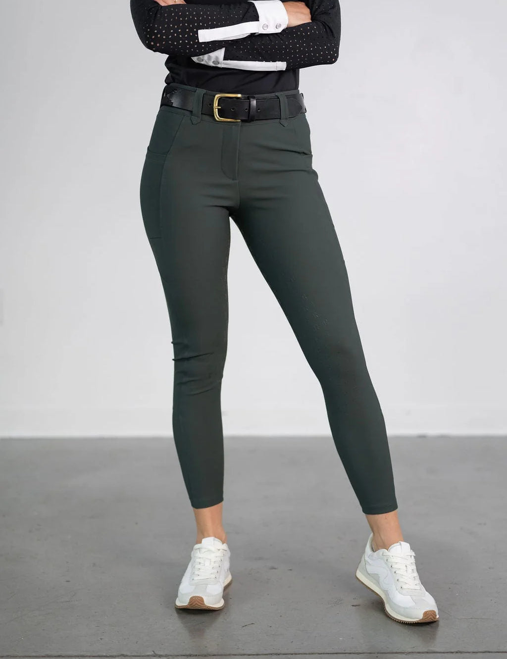 Front view of a model wearing the green Free Ride PRO Full Seat Breeches on a plain background