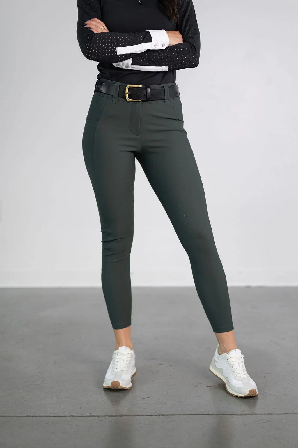 Front view of a model wearing the green Free Ride PRO Full Seat Breeches on a plain background