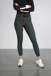 Front view of a model wearing the green Free Ride PRO Full Seat Breeches on a plain background