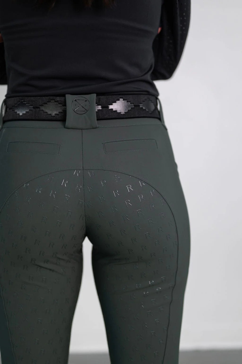 Close-up back view of the green Free Ride PRO Full Seat Breeches on a plain background