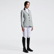 Angled front view of a female model wearing the gray Cavalleria Toscana GP Perforated Riding Jacket on a plain background